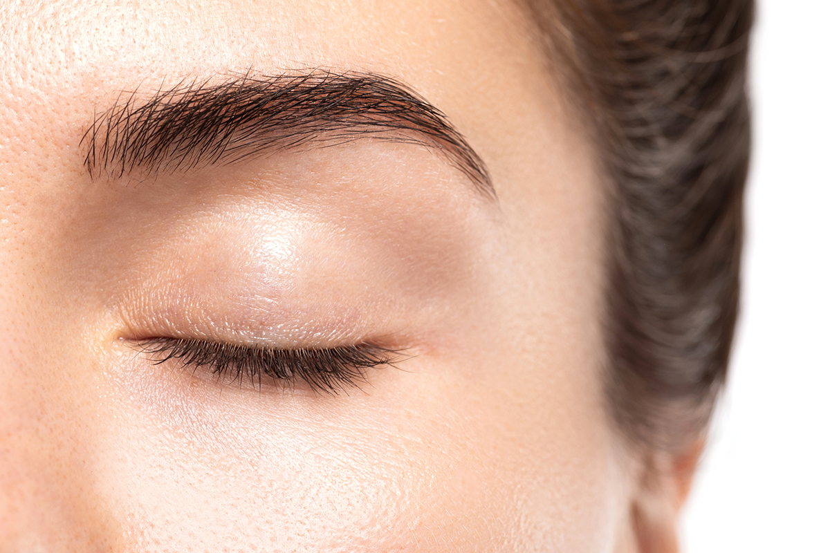 Closeup of young female eye without makeup