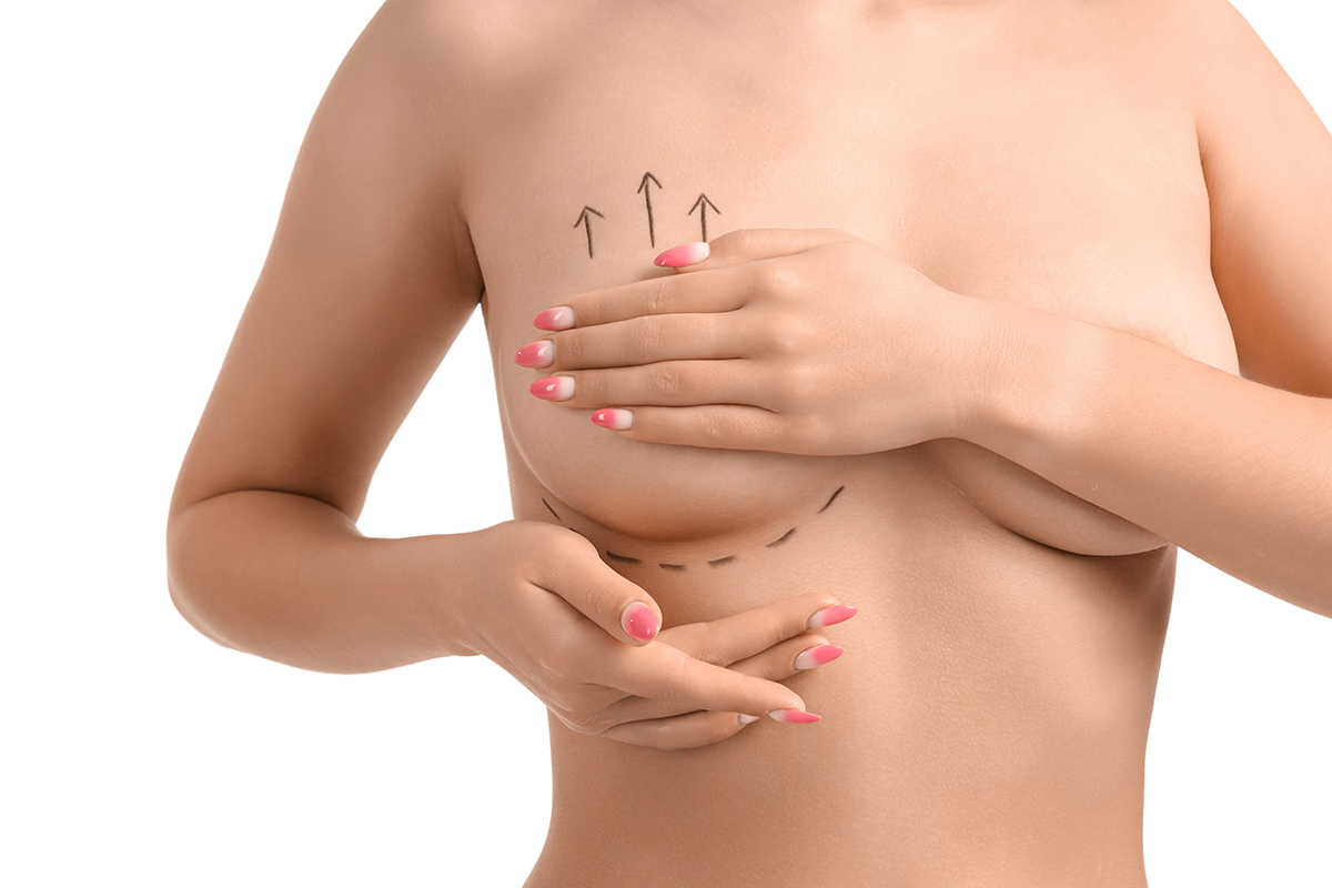 Naked young woman with marks on her breast