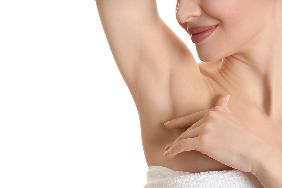 Young beautiful woman showing armpit with smooth clean skin